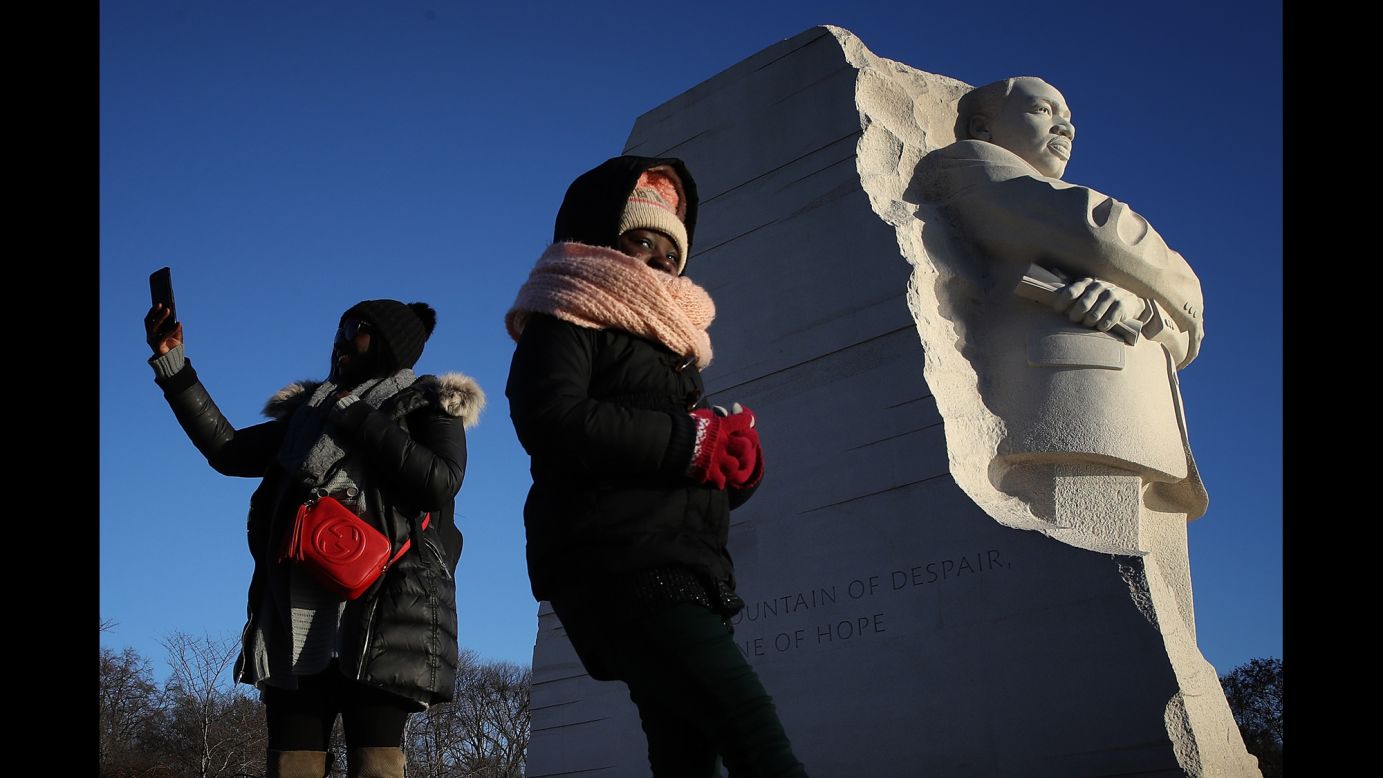 Saoudatou Dia and her daughter Aminah visit the Martin Luther King Jr. Memorial in Washington on the January 15 holiday celebrating the late civil rights leader.