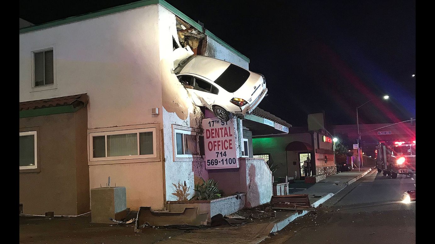 A sedan remains wedged into the second story of a dental office in Santa Ana, California. <a href="http://www.cnn.com/videos/us/2018/01/15/car-crashes-into-second-floor-dental-office-cabrera-nr.cnn" target="_blank">The car went flying into the air after slamming into a median</a> on Saturday, January 13. Two people were taken to the hospital with minor injuries.