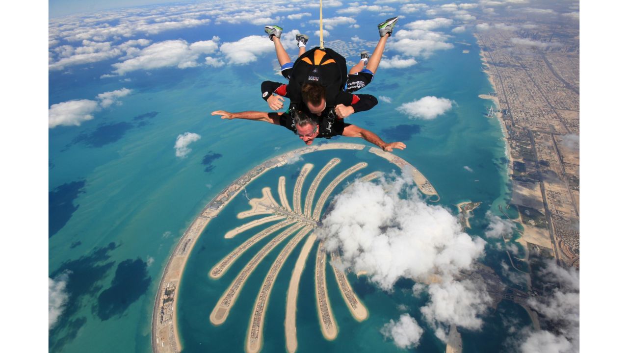 The ultimate thrill in one of the world's ultimate destinations: Two people tandem skydive over the Palm Jumeirah in Dubai.