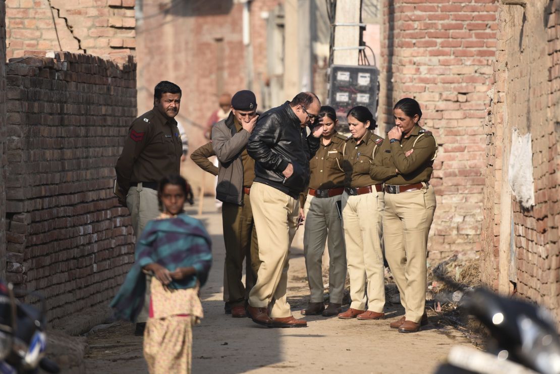 A police team arrives at the house of a 19-year old student after his body was discovered near Kirmach village in Haryana. 