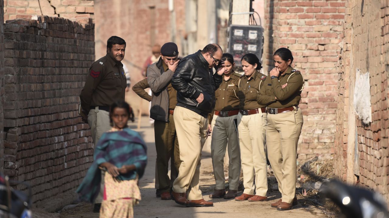 A police team arrives at the house of a 19-year old student after his body was discovered near Kirmach village in Haryana. 