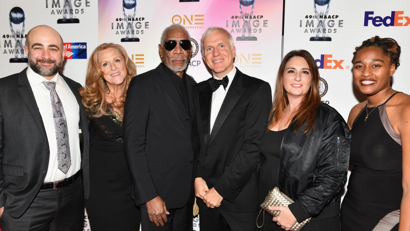Freeman, the host and executive producer of the series "The Story of God with Morgan Freeman," poses with co-producer Reza Riazi (left), executive producer Lori McCreary, writer and executive producer James Younger, co-producer Kelly Mendelsohn and Alicia Marie Agramonte at  the 49th NAACP Image Awards Non-Televised Awards Dinner in Pasadena, California, on January 14, 2018.