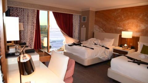 A window broken by Paddock and the interior of his hotel room.