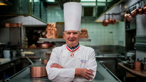Paul Bocuse poses in the kitchen of his restaurant, l'Auberge du Pont de Collonges, near Lyon, in 2012.