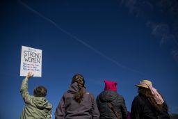 A demonstrator holds a sign that reads "Here's To Strong Women" during the Women's March in Washington on Saturday.