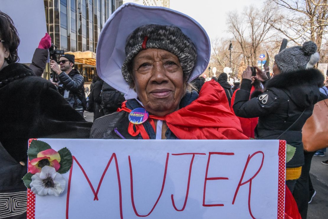 A woman holds a sign that says "mujer" -- the Spanish word for "woman" -- during a demonstration in New York.