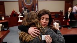 Larissa Boyce (R) gets a hug from Alexis Alvarado, both victims of Larry Nassar, during a hearing in Ingham County Circuit Court on November 22, 2017 in Lansing, Michigan.
Former USA Gymnastics team doctor Lawrence (Larry) Nassar, accused of molesting dozens of female athletes over several decades, on Wednesday pleaded guilty to multiple counts of criminal sexual conduct. Nassar -- who was involved with USA Gymnastics for nearly three decades and worked with the country's gymnasts at four separate Olympic Games -- could face at least 25 years in prison on the charges brought in Michigan.
 / AFP PHOTO / JEFF KOWALSKY        (Photo credit should read JEFF KOWALSKY/AFP/Getty Images)
