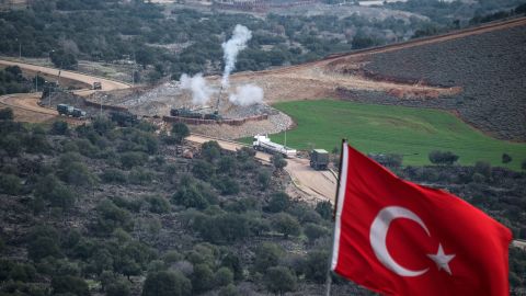 Turkish artillery shell YPG positions near the Syrian border on Sunday. 