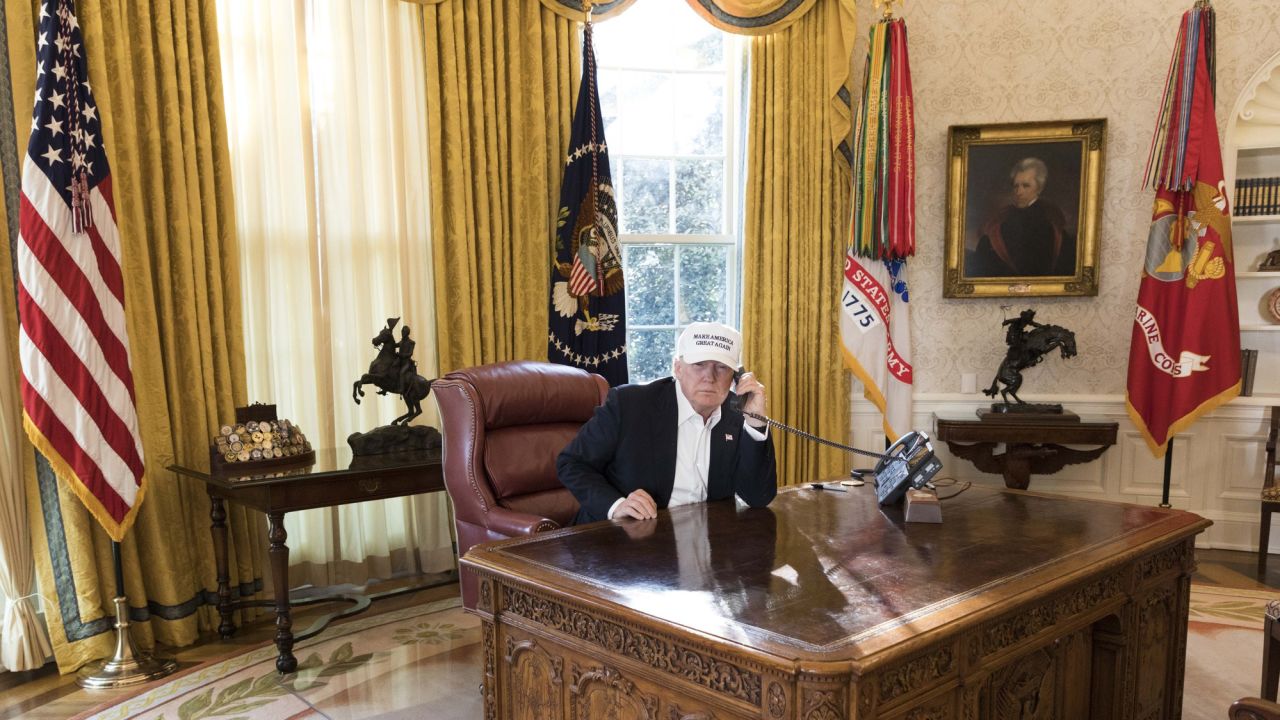 President Donald J. Trump talks on the phone in the Oval Office receiving the latest updates from Capitol Hill on negotiations to end the Democrats government shutdown, Saturday, January 20, 2018, at the White House in Washington, D.C.