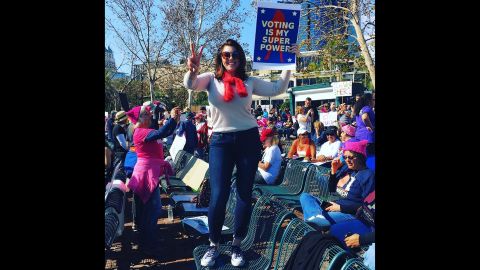 Kari Whaley holds a sign during a march in Orlando, Florida.