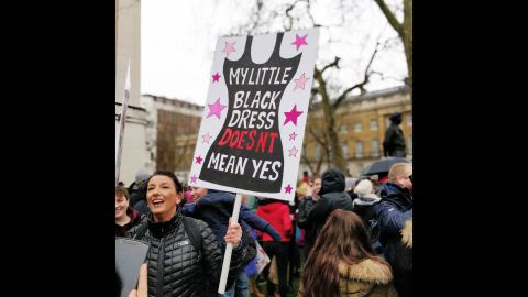 A protester carries a sign while marching in London on Sunday.