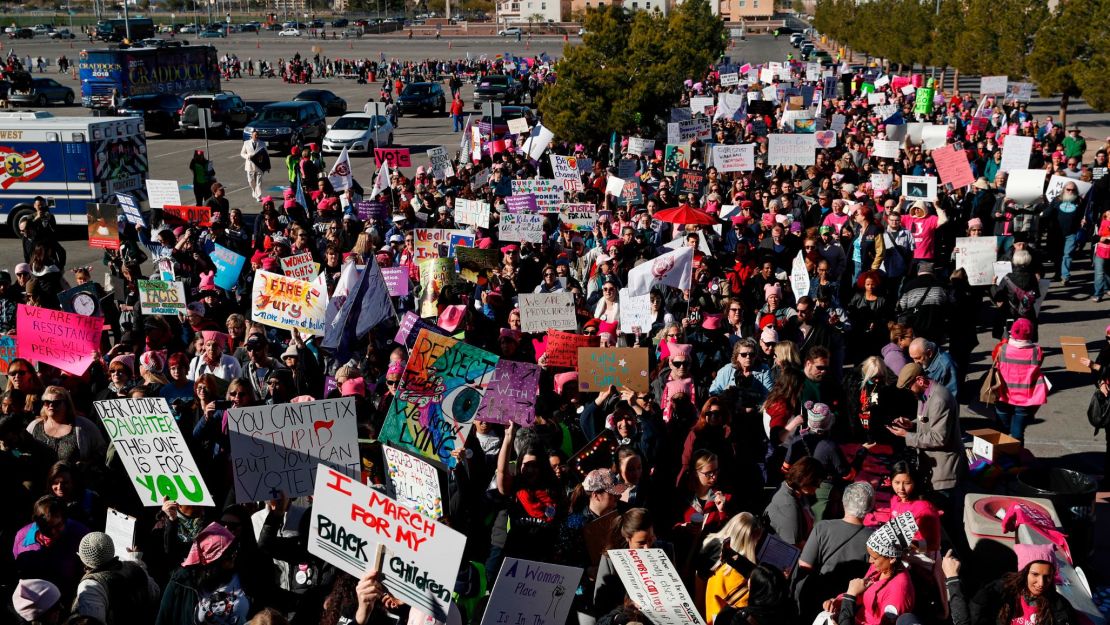 People attend the Women's March on Sunday in Las Vegas.