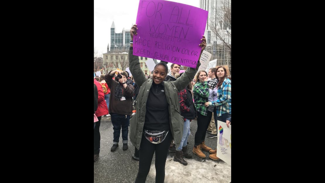 Olivia Bartholomew holds a sign while attending the Women's March in Pittsburgh.