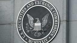 WASHINGTON - SEPTEMBER 18:  The U.S. Securities and Exchange Commission seal hangs on the facade of its building September 18, 2008 in Washington, DC. Republican presidential candidate Sen. John McCain (R-AZ) has called for the ouster of SEC Chairman Christopher Cox in the wake of the collapse of several giant banks on Wall Street and the resulting financial crisis.  (Photo by Chip Somodevilla/Getty Images)