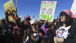 LAS VEGAS, NV - JANUARY 21:  Protesters carry signs as they make their way to Sam Boyd Stadium for the Women's March "Power to the Polls" voter registration tour launch on January 21, 2018, in Las Vegas, Nevada. Demonstrators across the nation gathered over the weekend, one year after the historic Women's March on Washington, D.C., to protest President Donald Trump's administration and to raise awareness for women's issues.  (Photo by Sam Morris/Getty Images)