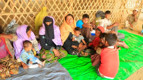Exhausted, the newly arrived group of refugees from Buthidaung in northern Rakhine State finally reach safety at the Balukhali camp, Cox's Bazar. 