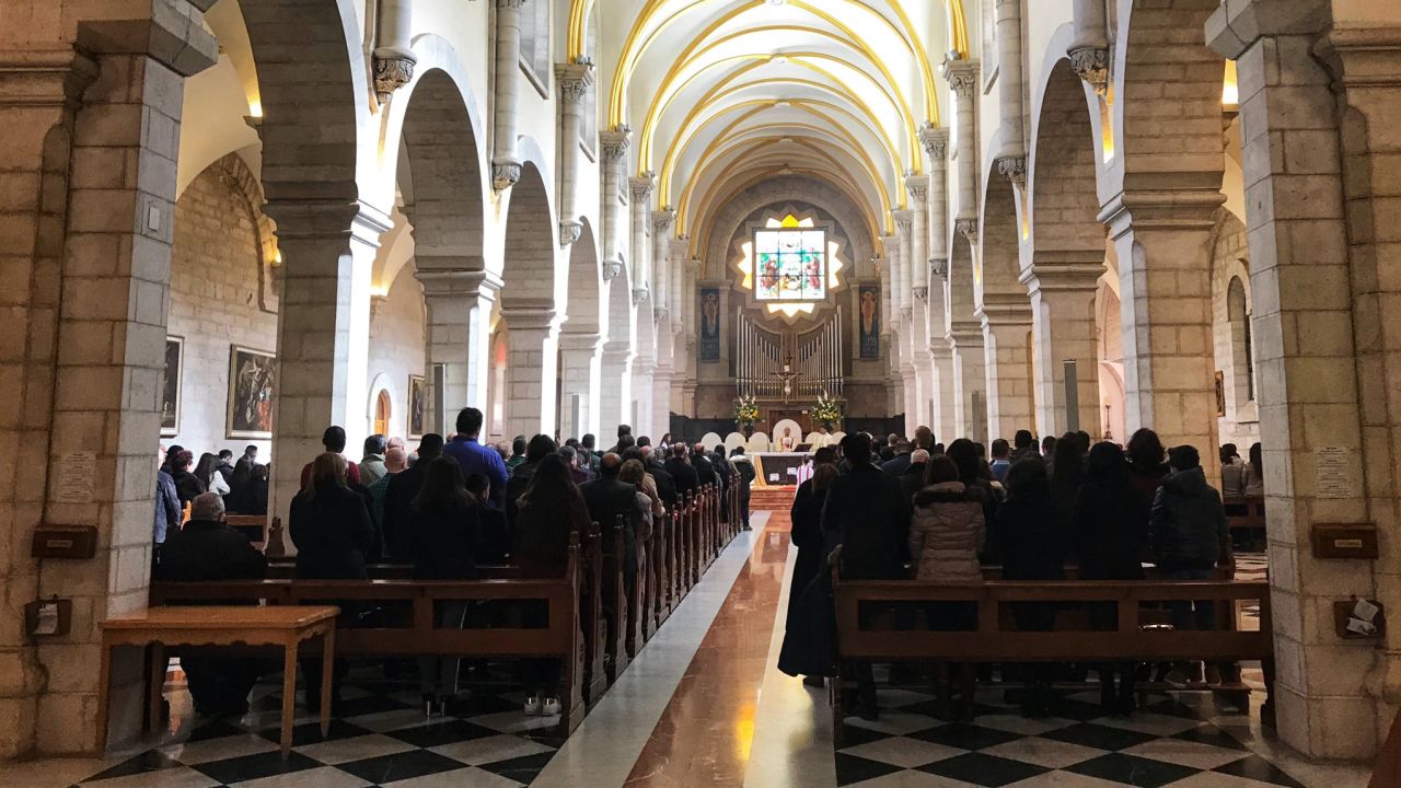 Latin Church Sunday prayer taking place  inside the Church of the Nativity.
