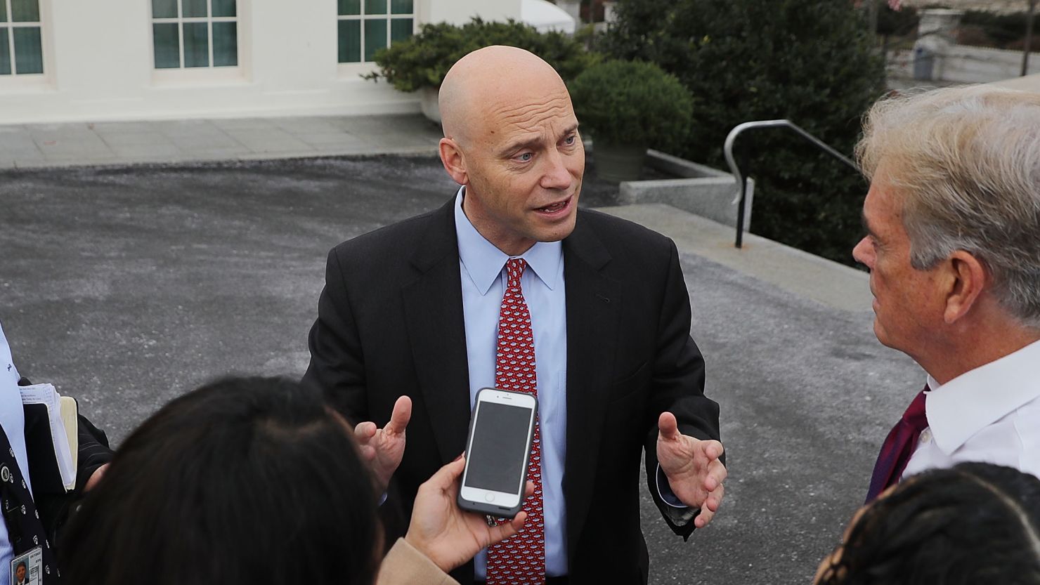 White House Legislative Affairs Director Marc Short (C) talks briefly with reporters about the ongoing partial federal government shutdown before heading back into the White House January 22, 2018 in Washington, DC.