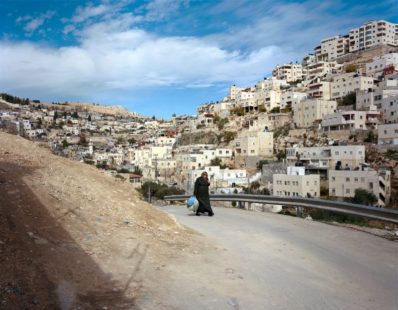 Acclaimed German photographer Thomas Struth offers his personal view of Israel and the Palestinian territories in 18 essential photographs taken over eight trips between 2009 and 2014. This one is from the Silwan neighborhood of East Jerusalem, depicting a Palestinian woman. "This picture is about the fact that what's happening there is embedded in every individual, such as this woman, highlighting the relationship between the individual and the community," he said.