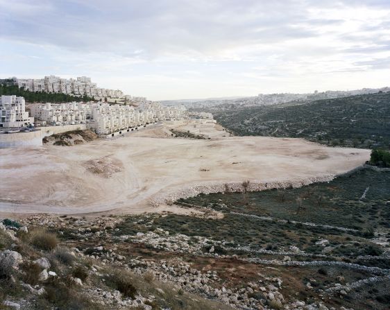 The controversial Israeli settlement of Har Homa in East Jerusalem,  considered <a href="index.php?page=&url=http%3A%2F%2Fedition.cnn.com%2F2017%2F02%2F01%2Fmiddleeast%2Fsettlements-explainer%2Findex.html">occupied territory</a> by most of the world: "I photographed this settlement several times, trying to get a picture, but I ended up taking one extra trip specifically to look at it again. When I arrived I realized works to enlarge the settlement had started, so I found this point of view which makes it look like a tongue, reaching further into the land."