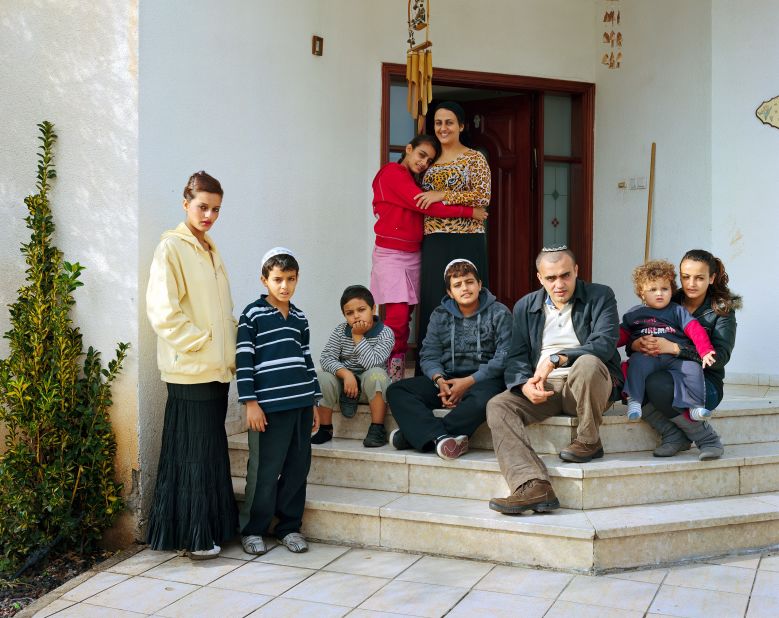 The exhibition includes two family portraits. This is the Faez family, photographed in Rehovot, Israel. "The Faez family was introduced to me in 2009 by Frederic Brenner, the French photographer who initiated the project. Frederic and I had lunch with them, I made the picture outside the entrance of the family's house."<br />