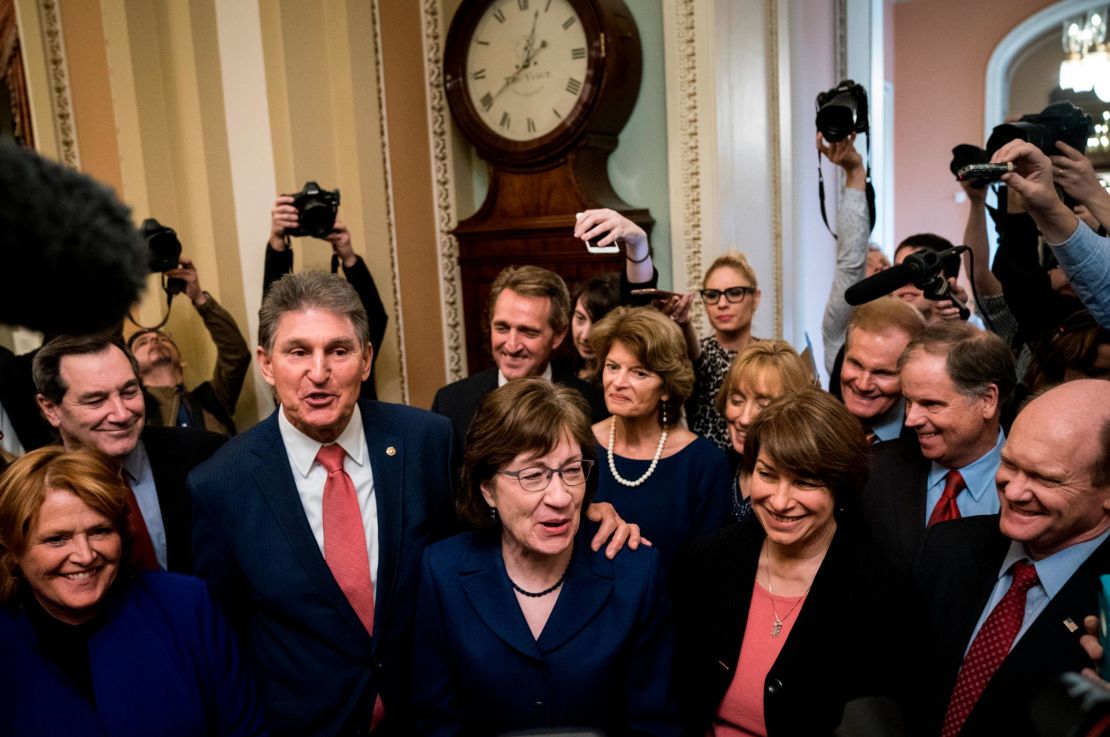 Senators Joe Manchin (D-WV) and Susan Collins (R-ME) lead a group of bipartisan Senators as they speak to reporters after the Senate passed a procedural vote for a continuing resolution to fund the federal government on Monday. (Photo by Drew Angerer/Getty Images)