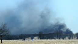 Smoke billows from the site of a gas well fire near Quinton, Oklahoma, early Monday.