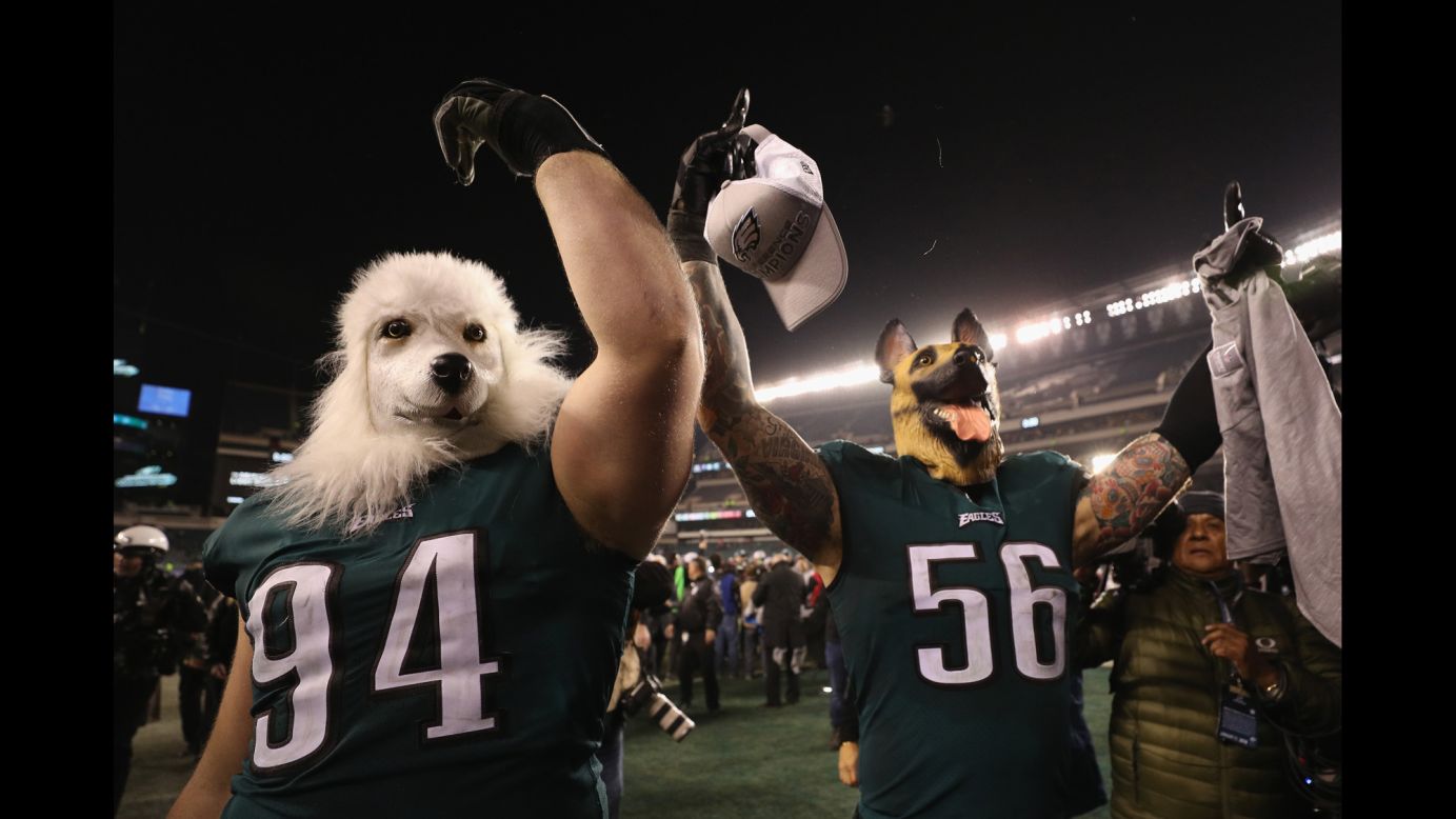 Philadelphia Eagles' defensive tackle, Beau Allen, left and defensive end, Chris Long, right, celebrate their team's win over the Minnesota Vikings in the NFC Championship game while wearing dog masks on Sunday, January 21, in Philadelphia, Pennsylvania.<br />