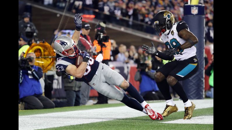 Patriots wide receiver Danny Amendola catches a touchdown pass as he is defended by the Jaguars' Tashaun Gipson in the fourth quarter during the AFC Championship Game on Sunday, January 21, in Foxborough, Massachusetts.<br />