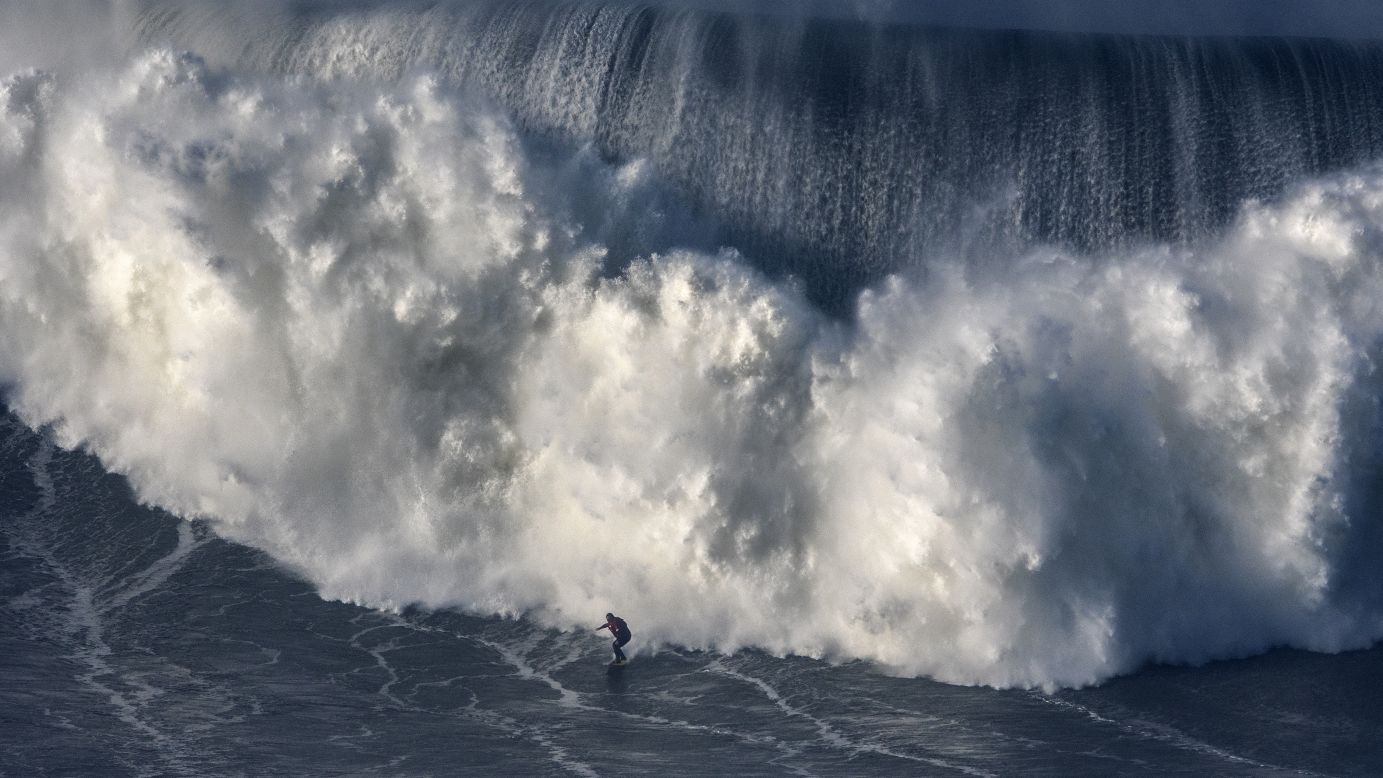 Australian big wave surfer Ross Clarke-Jones drops a wave during a surf session at Praia do Norte on Thursday, January 18, in Nazare, Portugal. Nazare is known for its massive waves, reportedly created by a deep undersea canyon combined with winter storms.