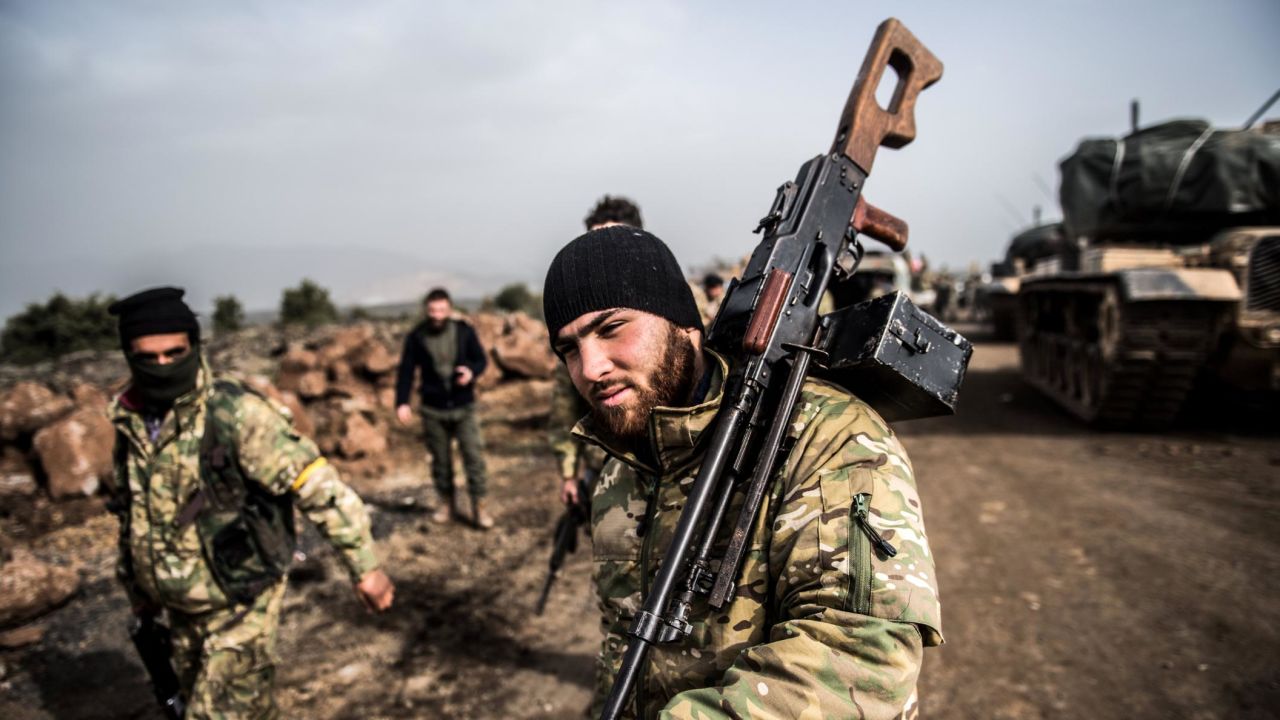 Turkish troops advance near the Syrian border at Hassaas.