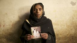 Aasia Bibi, 35, domestic worker. She is mother of Laiba Saleem, seen here holding a photograph of Laiba and her other daughter.