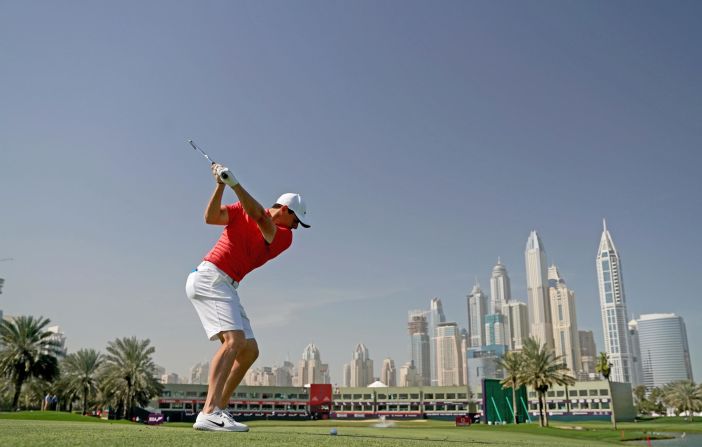 <strong>Reach for the sky:</strong> A fit-again Rory McIlroy drives on the 18th hole Majlis Course at the Emirates Golf Club in practice for the Omega Dubai Desert Classic on the European Tour.