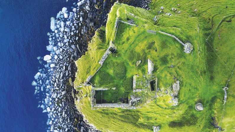 <strong>"View from Above" category -- Laura Daly (UK):</strong> Daly was on vacation on the Isle of Skye when she took this drone photograph of Duntulm Castle: "I chose to include the bright blue water of the ocean as it perfectly complemented the lush green grass, especially with the soft sunset light catching the walls of the castle," says Daly in a statement. "The view from above captures the beauty and lure of Skye, both natural and man-made."