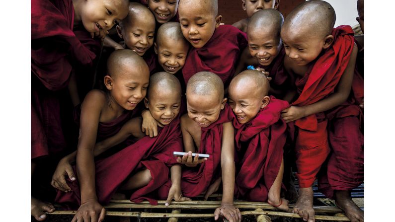 <strong>"Spirit of Travel" category -- Gunarto Gunawan (Indonesia):</strong> Gunawan was visiting Shwe Gu monastery, Bagan in Myanmar, when he took this photograph of young boys who are training to be Buddhist monks. "I showed them a funny video on my iPhone -- I did not expect them to be so excited!" recalls the photographer. "In the end, they were all scrambling to watch the video. Seeing them laugh, I immediately took my camera and photographed this magical moment."