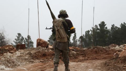 A Turkish-backed Syrian rebel fighter stands near Mount Bersaya, north of the Syrian town of Azaz close to the border with Turkey on January 22, 2018.