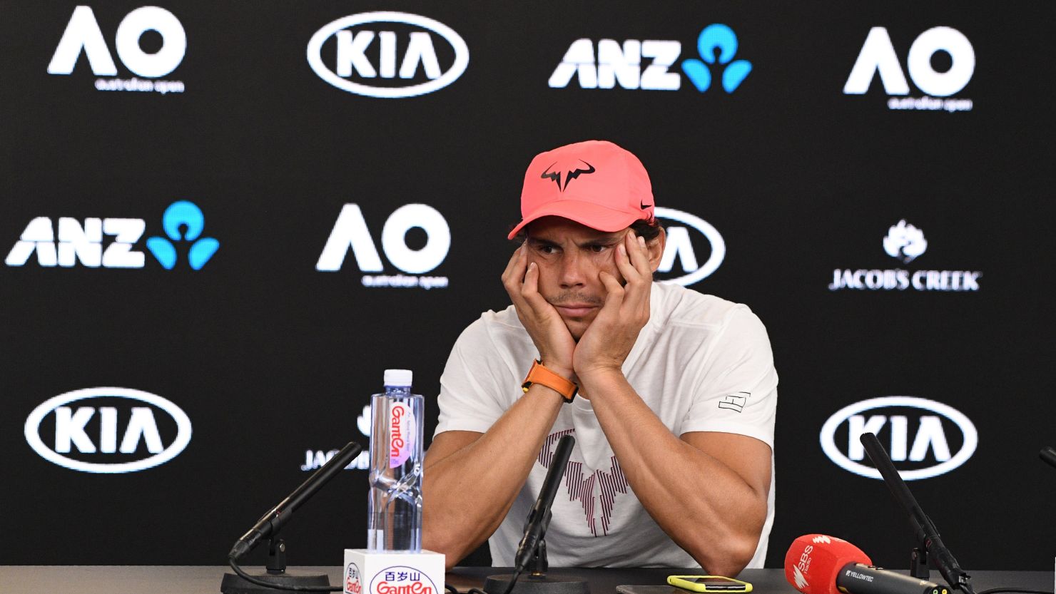 TOPSHOT - Spain's Rafael Nadal attends a press conference after retiring against Croatia's Marin Cilic in their men's singles quarter-finals match on day nine of the Australian Open tennis tournament in Melbourne on January 23, 2018. / AFP PHOTO / SAEED KHAN / -- IMAGE RESTRICTED TO EDITORIAL USE - STRICTLY NO COMMERCIAL USE --        (Photo credit should read SAEED KHAN/AFP/Getty Images)