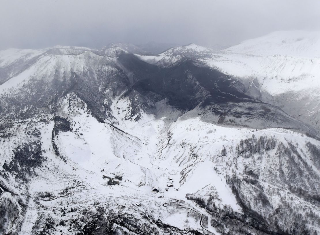 Ashes from Mount Kusatsu-Shirane cover near its summit after its eruption in Kusatsu, Gunma prefecture, central Japan, Tuesday, January 23.