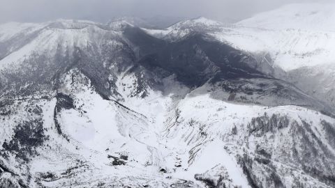 Ashes from Mount Kusatsu-Shirane cover near its summit after its eruption in Kusatsu, Gunma prefecture, central Japan, Tuesday, January 23.