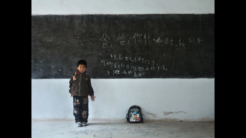 Zhao Jinbao, 7, Matan Elementary School, Gansu. His message reads: "Dad, when are you coming back? My dad went to Baiyin to work for a year. Mom cooks and works in the field."<br />
