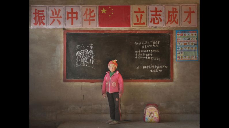Wang Baohua, 11, Majiawan Elementary School, Longmen County, Gansu. "My dad comes to join my mom's family. I like daddy. He always buys me good stuff. Daddy and mommy love each other. Grandpa and grandma also like dad. Happy family."<br />