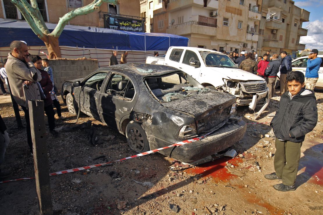 A car is cordoned off outside the mosque in Benghazi after the attack.
