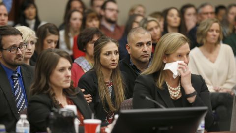 People react as former Michigan State University and USA Gymnastics doctor Larry Nassar listens to impact statements during the sentencing phase in Ingham County Circuit Court on January 24, 2018 in Lansing, Michigan.
