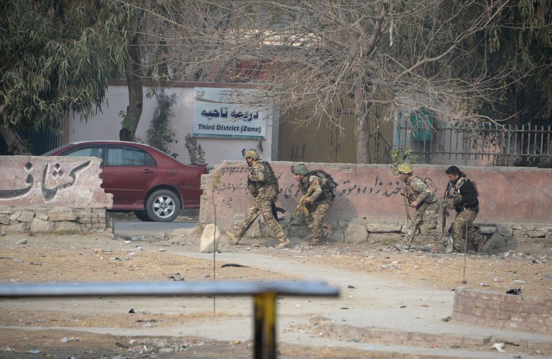 Afghan army soldiers take positions near the global charity's office Wednesday. 