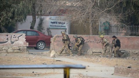 Afghan army soldiers take positions near the global charity's office Wednesday.