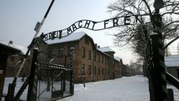 This picture taken on December 18, 2009 shows a replica hung in place of the stolen infamous "Arbeit macht frei" sign at the former Nazi death camp Auschwitz in Oswiecim, Poland.  The theft of the infamous "Arbeit macht frei" sign at the Nazi German-era Auschwitz death camp in Poland sparked outrage on December 18, 2009, as police launched a hunt for the perpetrators. "The inscription was stolen early this morning," Auschwitz-Birkenau Museum spokesman Jaroslaw Mensfelt told AFP, adding that the thieves must have known what they were doing.  AFP PHOTO/PAP/JACEK BEDNARCZYK - POLAND OUT - (Photo credit should read JACEK BEDNARCZYK/AFP/Getty Images)