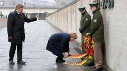 German Chancellor Angela Merkel lays a wreath at the International Memorial of former Nazi concentration camp of Dachau, southwestern Germany, on May 3, 2015. 