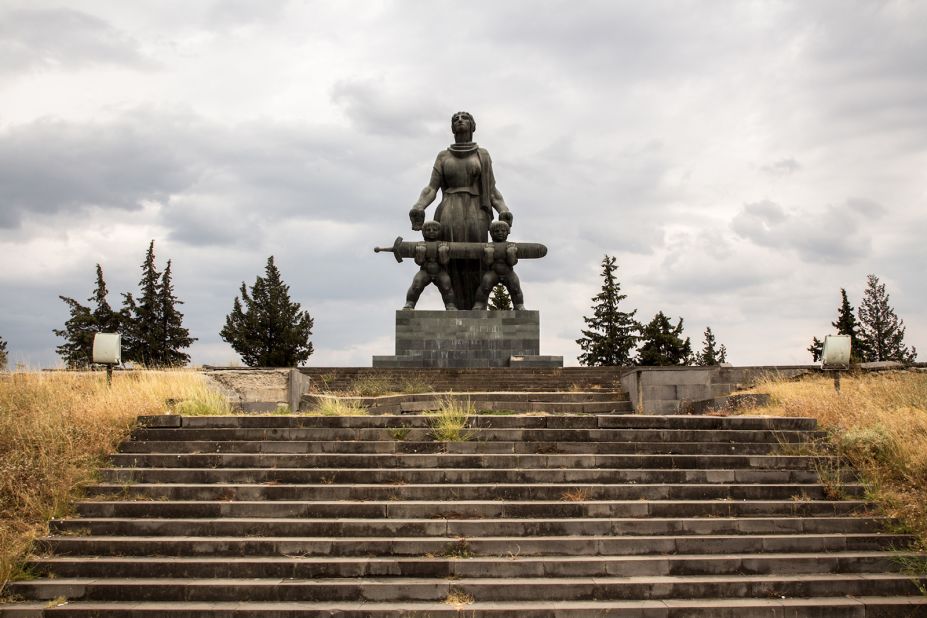 Monument to Heroes of the Great Patriotic War (1975) by architect N Bakradze and sculptor Merab Berdzenishvili in Marneuli. A plaque at the memorial sites reads: "And They Shall Grow!"