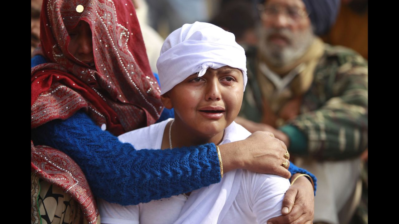 The son of Indian civilian Gopal Dass, who was killed during reported clashes between Indian and Pakistani soldiers, cries in the village of Jhiri in the region of Jammu and Kashmir State, India, on Monday, January 22. <a href="https://apnews.com/f9f276f7f4f249e2a5514cdd8d514960/India,-Pakistan-continue-trading-fire-and-blame-in-Kashmir" target="_blank" target="_blank">According to the Associated Press</a>, "Indian and Pakistani soldiers again targeted each other's posts and villages along their volatile frontier in disputed Kashmir after a day's lull, killing at least one civilian and wounding three others, officials said Monday." India and Pakistan have been <a href="https://www.cnn.com/2013/11/08/world/kashmir-fast-facts/index.html" target="_blank">fighting over Kashmir</a> since both countries gained their independence in 1947.
