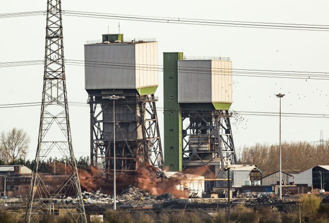 The Kellingley Colliery was the largest coal mine in Britain when the extraction of coal began at the site in 1965. Known as "The Big K", it hired more than 2,300 miners in the 1990s, and its two main shafts were each almost 800 meters deep. The colliery closed in 2015 due to a decline in UK coal production. It has been demolished to make way for a manufacturing and distribution space. 